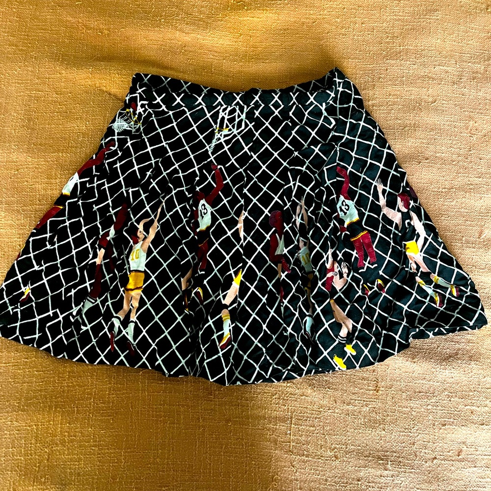 Urban Outfitters pleated miniskirt in a basketball net pattern